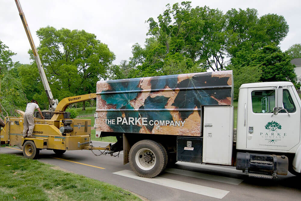 The Parke Company truck and wood chipper for emergency landscaping