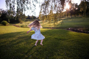 Girl playing in the grass
