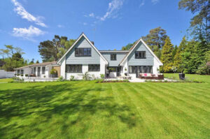 Freshly mowed lawn in front of house for sale