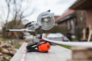 PPE headphones and saw on a table